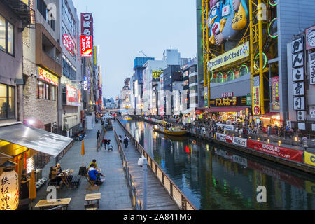 Osaka, Japan - People sightseeing in Dotonbori area, main tourists attraction and shopping district. Stock Photo