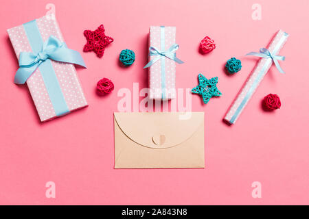 Top view of envelope on pink background. New Year decorations. Christmas holiday concept. Stock Photo