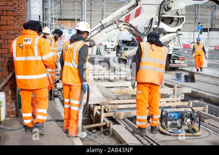 Last concrete pour on the track of the Trafford Park Metrolink Line, Stock Photo