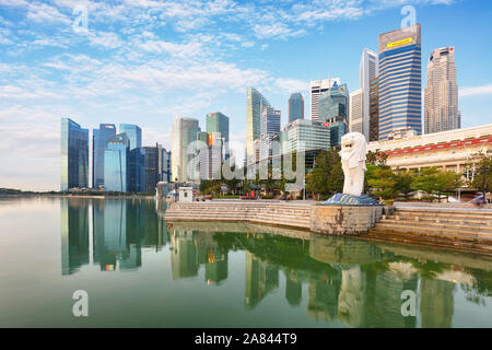 SINGAPORE - OCTOBER 11, 2019: Merlion statue fountain in Merlion Park and Singapore city skyline on December 16, 2014. This fountain is one of most we