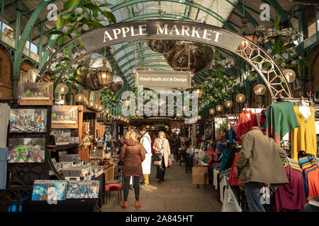 Apple Market at Covent Garden, London during November, people looking for arts and crafts products. Stock Photo