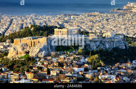 Aerial view over Athens with te Acropolis and harbour from Lycabettus hill, Greece at sunrise Stock Photo
