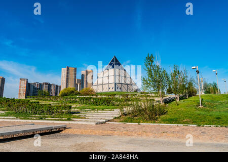 Nur-Sultan Astana Palace of Peace and Reconciliation Pyramid Building View on a Sunny Blue Sky Day Stock Photo