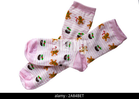 Girl's festive socks, pink and white stripes with Christmas puddings and gingerbread men on isolated on white background Stock Photo