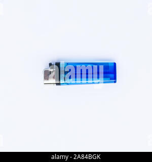 Blue plastic blank gas lighter. Gas lighter isolated on a white background. Closeup shot, top view Stock Photo
