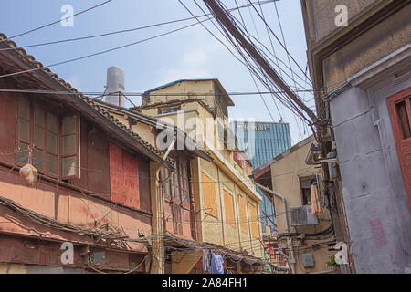 Editorial: SHANGHAI, CHINA, April 17, 2019 - New buildings together with the old city neighborhood in Shanghai Stock Photo