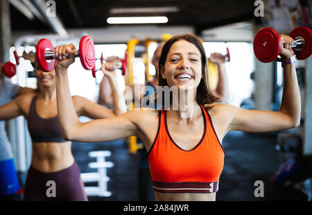 Beautiful fit women working out in gym Stock Photo