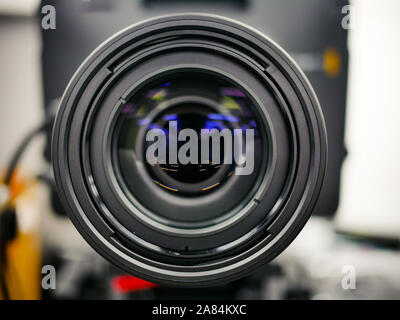 Close up shot of camera lens set up filming in the studio. Reflection in the lens. Stock Photo