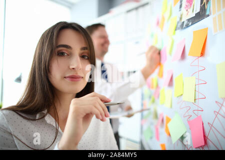 Lovely woman holding pen Stock Photo