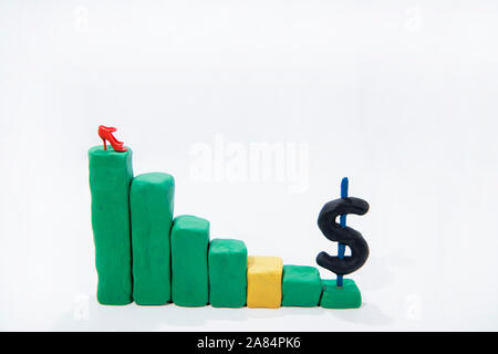 Businesswoman conceptual photo.  Graph made from Play Clay with dollar sign. Stock Photo