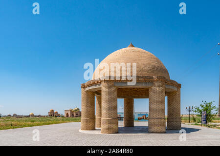 Turkestan Arystan Bab Mausoleum Pavilion with Golden Cupola Mausoleums at Background on a Sunny Blue Sky Day Stock Photo