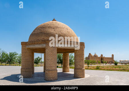 Turkestan Arystan Bab Mausoleum Pavilion with Main Tomb Building at Background on a Sunny Blue Sky Day Stock Photo