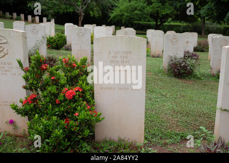 Sri Lanka, Trincomalee, Uppuveli, Commonwealth War Cemetery, graves and main cross memorial Stock Photo