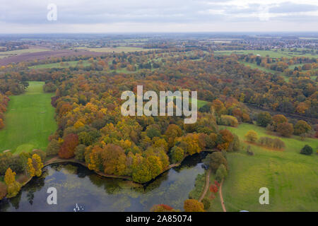 Aerial photo in autumn showing the beautiful autumn fall colours of a park in Leeds known as Roundhay Park in West Yorkshire UK, showing a typical Bri Stock Photo