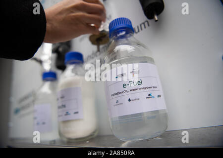 Eggenstein Leopoldshafen, Germany. 06th Nov, 2019. A bottle of e-Fuels stands on the North Campus of the Karlsruhe Institute of Technology (KIT) in a research facility with which CO2-neutral fuel can be produced from air and green electricity using 'Power-to-X' technologies (P2X). The plant was officially put into operation. Credit: Marijan Murat/dpa/Alamy Live News Stock Photo