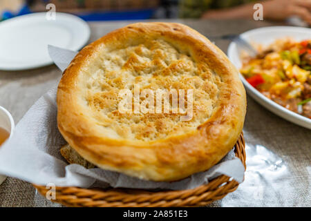 Traditional Mouthwatering Tasty Central Asian Uyghur Nan Bread on a White Plate Stock Photo