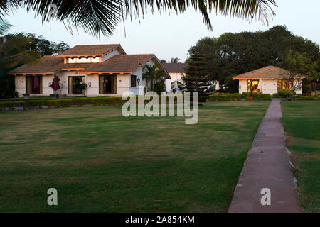 Garden and cottage rooms of upscale luxury resort at a Beach. La Calypso, Baga beach, Goa, India Stock Photo