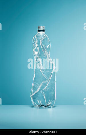 Crumpled, empty plastic water bottle Stock Photo