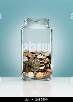 Euro coins in glass jar Stock Photo
