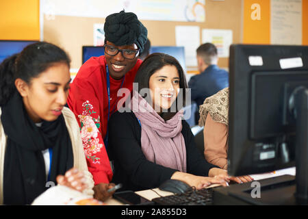 Female college students using computers in computer lab Stock Photo