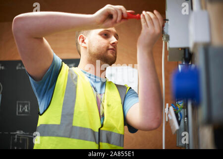 Male electrician student using screwdriver Stock Photo