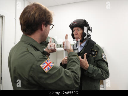 RAF veteran John Allinson is fitted with a helmet prior to a flight in a Spitfire at Solent Airport, who has achieved the 'ambition of a lifetime' by taking a flight in a Spitfire organised as a thank you for his 'selfless' caring for his wife. PA Photo. Picture date: Wednesday November 6, 2019. John Allinson, from Reading, Berkshire, was given the chance to fly in the fighter plane after his granddaughter contacted the Red Letter Days experience gift company. The 85-year-old, who served in the military police for five years from the age of 17 and who reached the rank of corporal, took his fli Stock Photo