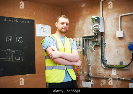 Portrait confident male electrician student Stock Photo