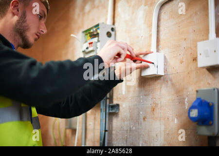 Male electrician student practicing in workshop Stock Photo