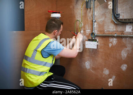 Male electrician student practicing in workshop Stock Photo