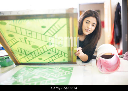 Female artist screen printing in art studio Stock Photo