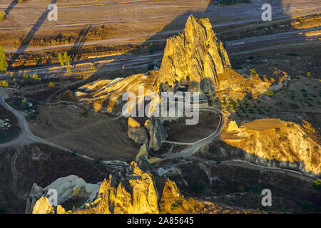 Elevated view of  Rock church and eroded landscape around at sunrise, Goreme Open Air Museum, Cappadocia, Turkey. Stock Photo