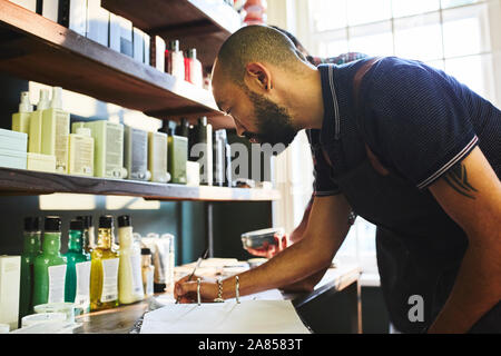 Male barbershop owner doing paperwork Stock Photo