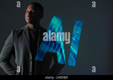 Double exposure serious businessman and AI text Stock Photo
