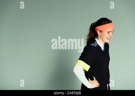 Confident teenage girl soccer player with hands on hips Stock Photo