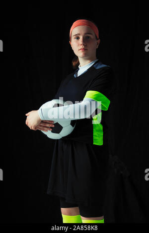 Portrait confident, determined teenage girl soccer player Stock Photo