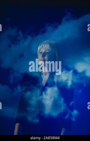 Double exposure determined businesswoman against blue sky with clouds Stock Photo