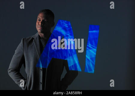 Double exposure businessman against AI text Stock Photo