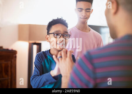 Father talking with sons Stock Photo
