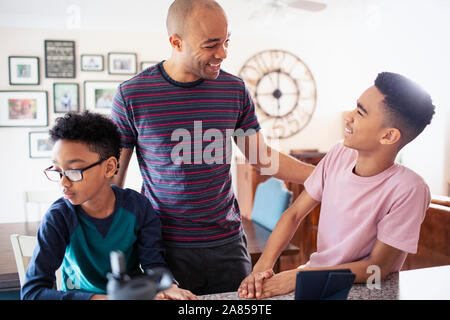 Father and sons talking Stock Photo