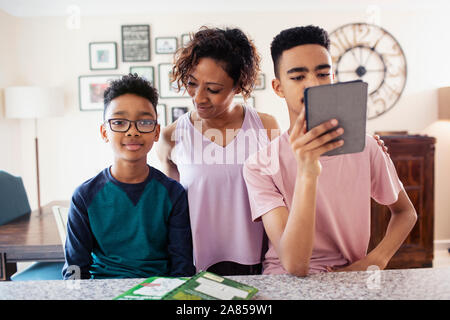 Mother and sons at home Stock Photo