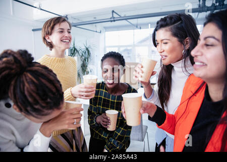 Happy businesswomen celebrating, drinking champagne Stock Photo