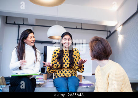 Businesswomen talking in conference room meeting Stock Photo