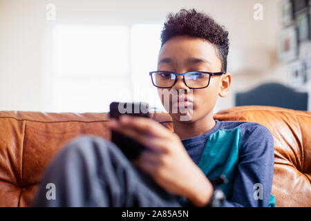 Boy using smart phone Stock Photo
