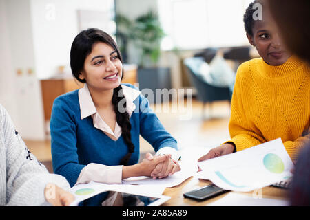 Businesswomen talking in meeting Stock Photo