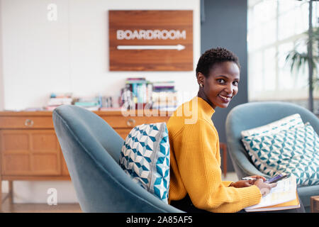 Portrait confident businesswoman working in office Stock Photo