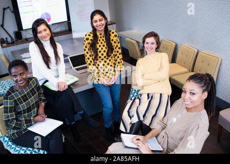 Portrait confident businesswomen in conference room meeting Stock Photo