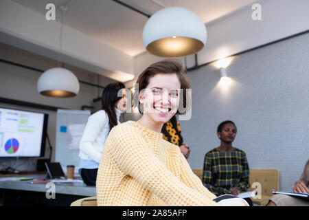Portrait smiling, confident businesswoman in conference room meeting Stock Photo