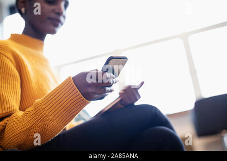 Businesswoman using smart phone Stock Photo