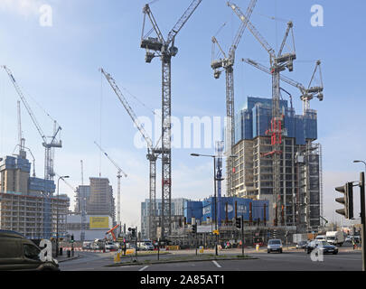 Cranes surround construction work at Vauxhall Cross, London. Shows work on the new One Nine Elms development (centre, right), two residential towers. Stock Photo