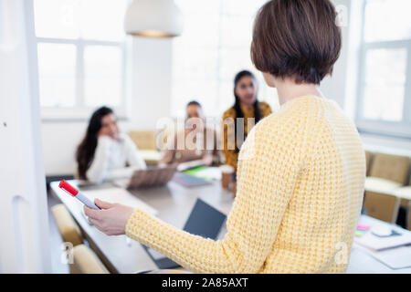 Businesswoman leading conference room meeting Stock Photo